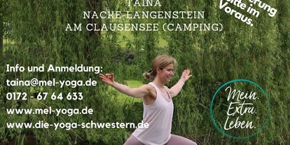 Yogakurs - Ambiente: Gemütlich - Mertesheim - Taina beim SUP-Yoga "Heldenstellung"  - Mein.Extra.Leben.Yoga© Taina Nacke-Langenstein