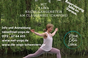 Yoga: Taina beim SUP-Yoga "Heldenstellung"  - Mein.Extra.Leben.Yoga© Taina Nacke-Langenstein
